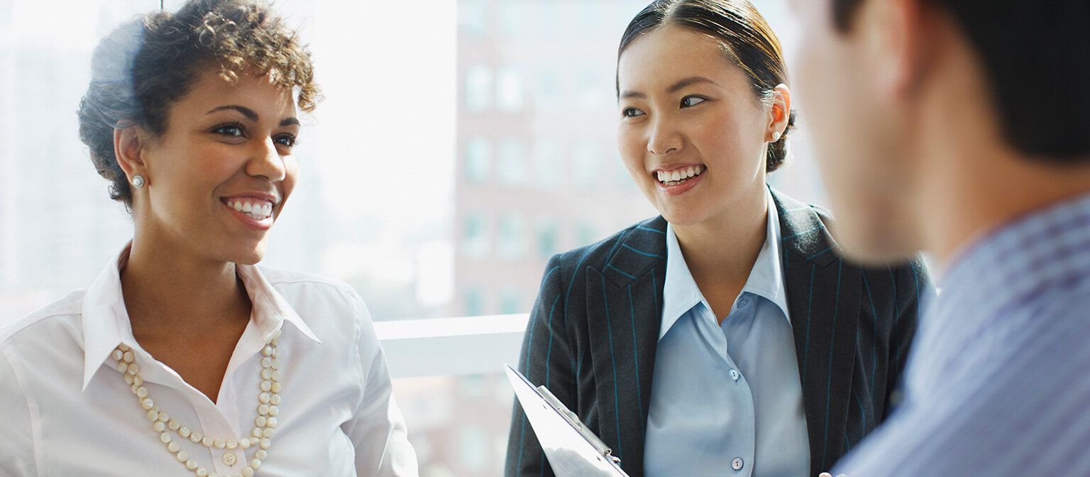 three business people smiling